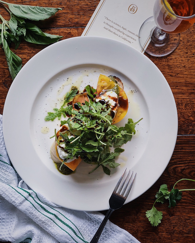 ⁠This Sourdough Crostini is a beautiful balance of Burrata Cheese, Heirloom Tomatoes, Arugula & Toasted Pumpkin Pesto.⁠ ⁠ ⁠ ⁠ 📸 @lilymorello⁠ #f52grams #monterey #carmelbythesea #californiadreaming #visitcarmel