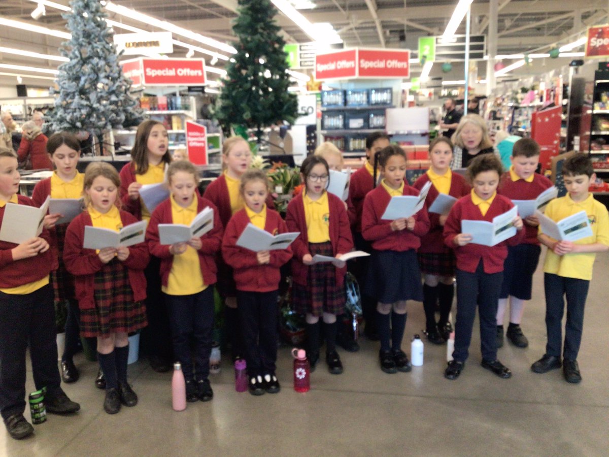 Members of the school choir have been to Asda to sing some Christmas songs. 🎄🎶 @StJamesChorley