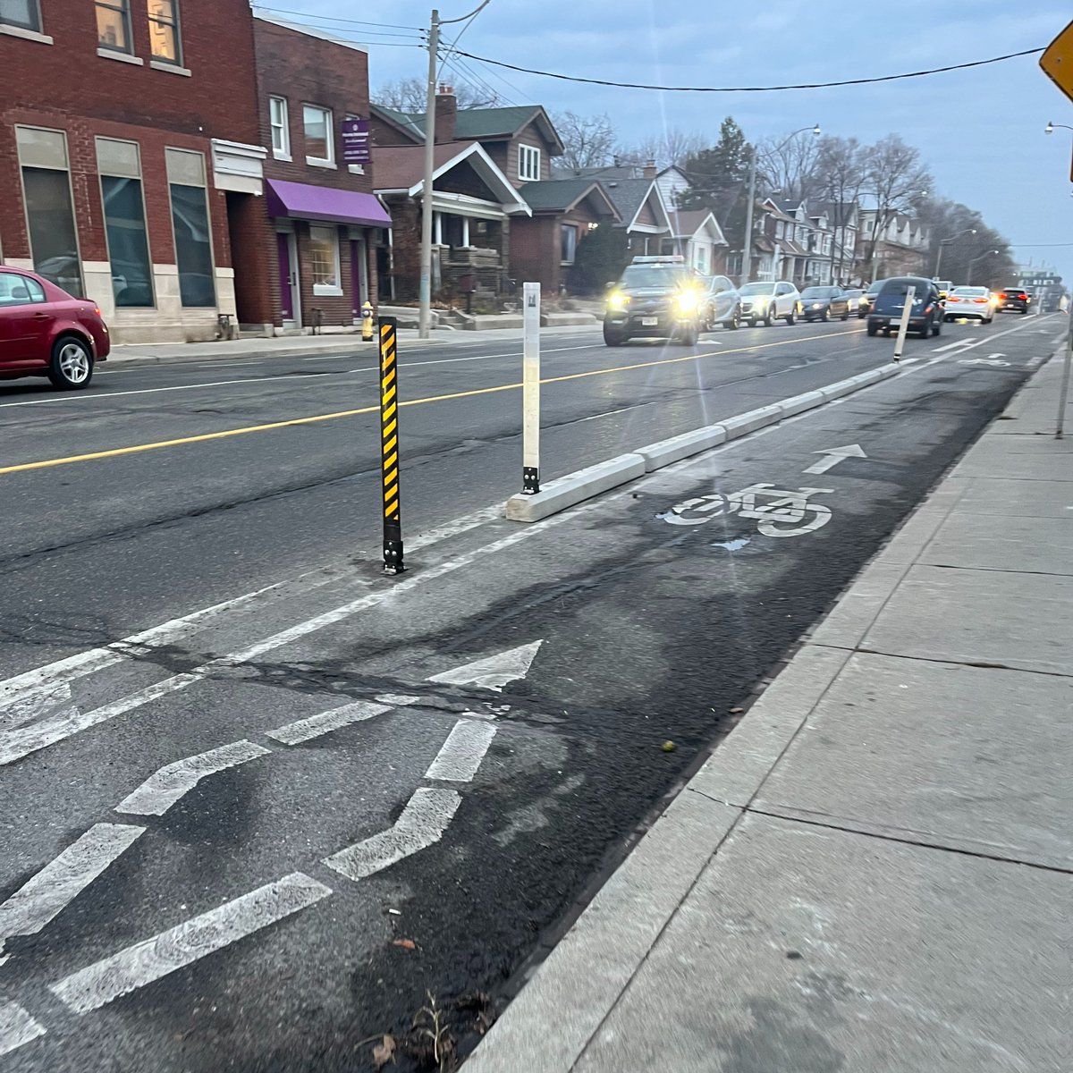Upgrades to the Woodbine Ave bikeways north of Danforth Ave to Cosburn Ave include concrete curbs as physical separation. People cycling on this route can connect to Taylor Creek Trail and Dawes Rd by following the recently-installed wayfinding signage and shared lane markings.