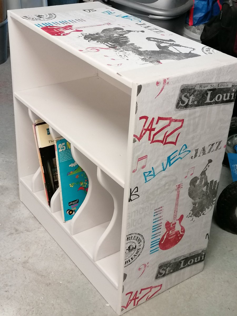 When this two door record storage cabinet came in I didn't hold out much hope for it, but structure was good, so I took the doors off, painted it and found the perfect wallpaper to decoupage it.