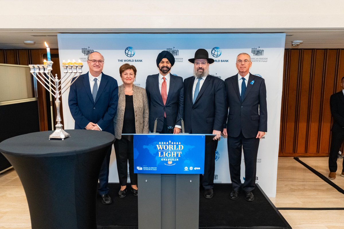 Bringing the illumination of the menorah to A World of Light - an international celebration in honor of Chanukah, Monday, December 11, 2023 at the World Bank. L to R: Ilan Goldfajn, President, InterAmerican Development Bank; Kristalina Georgieva, Managing Director, International…