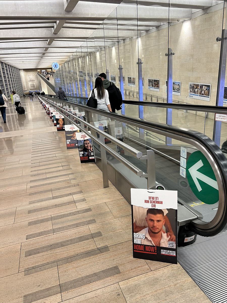 NatSanandaji's tweet photo. I arrived in Israel September 12th, and exactly three months later I’m back… but nothing feels the same. This long hall was once filled with so many Jews returning home, but now it’s filled with the faces of those we pray will soon return home https://t.co/HOM5Jn9yvm