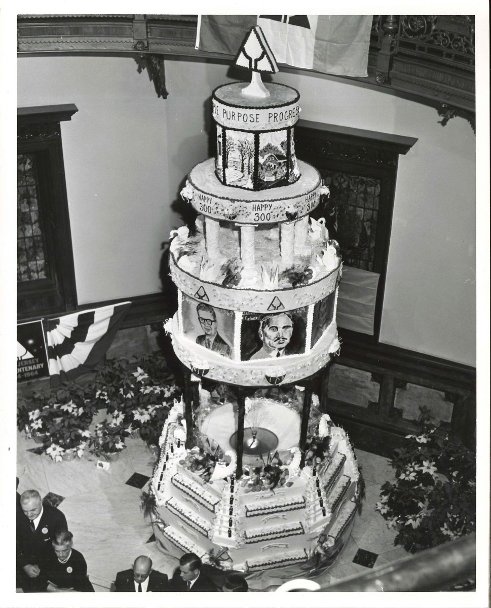 This holiday season, @NJStateArchives is highlighting New Jersey's 1964 Tercentenary cake. At 3,400-lbs., this tower of confection reached to the second floor of the State House Rotunda.