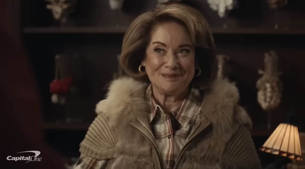 3/5 • During one stop, he encounters a smiling woman at a shop counter, played by Donna Pescow • Donna Pescow also played Annette in SNF • To drive the point home, they've given her a replica of Annette's costume from SNF @Adweek @CapitalOne