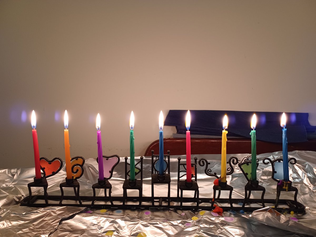 I had to email my building listserv to hunt down two red candles, but I achieved my annual goal of matching each candle to the colored glass behind its holder on the 8th night of #Hanukkah 🌈