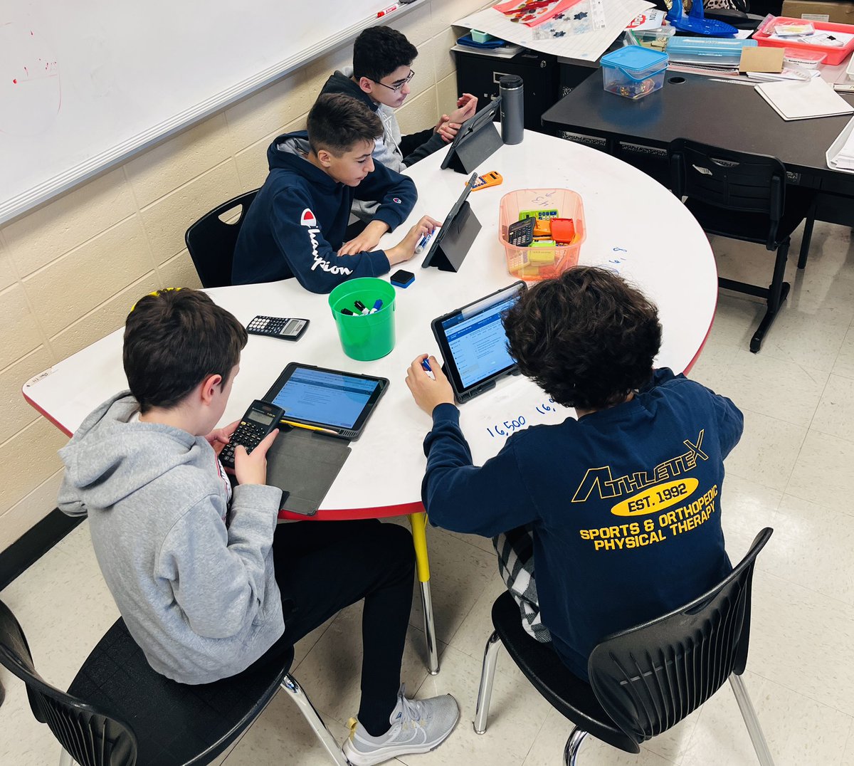 Students love using the whiteboard table for math! #OSD135