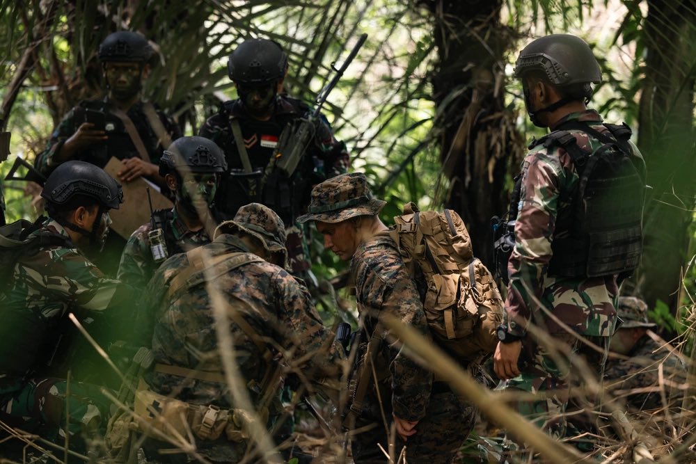 Teamwork U.S. Marines with Marine Rotational Force-Southeast Asia and Indonesian marines with 4th Marine Infantry Brigade, Pasmar 1, conduct a leaders reconnaissance during raid patrol to detain a simulated high value target during Keris Marine Exercise 2023.
