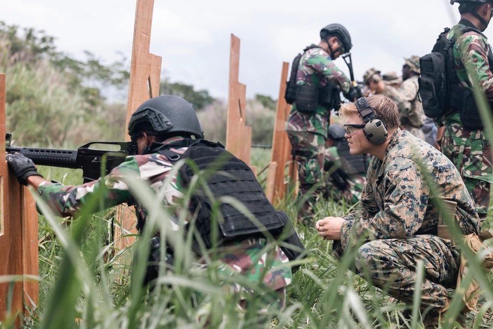 * U.S. Marines with Marine Rotational Force-Southeast Asia, and Indonesian marines with 4th Marine Infantry Bn., Pasmar 1, mark their groupings at a battle sight zero for table five combat marksmanship program training during Keris Marine Exercise 2023in Sukabumi, Indonesia.