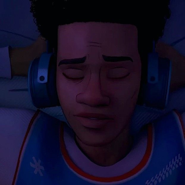 he’s vibing to music , in his own little world . 

    ‘ am i dreaming ’ playing on his headphones .