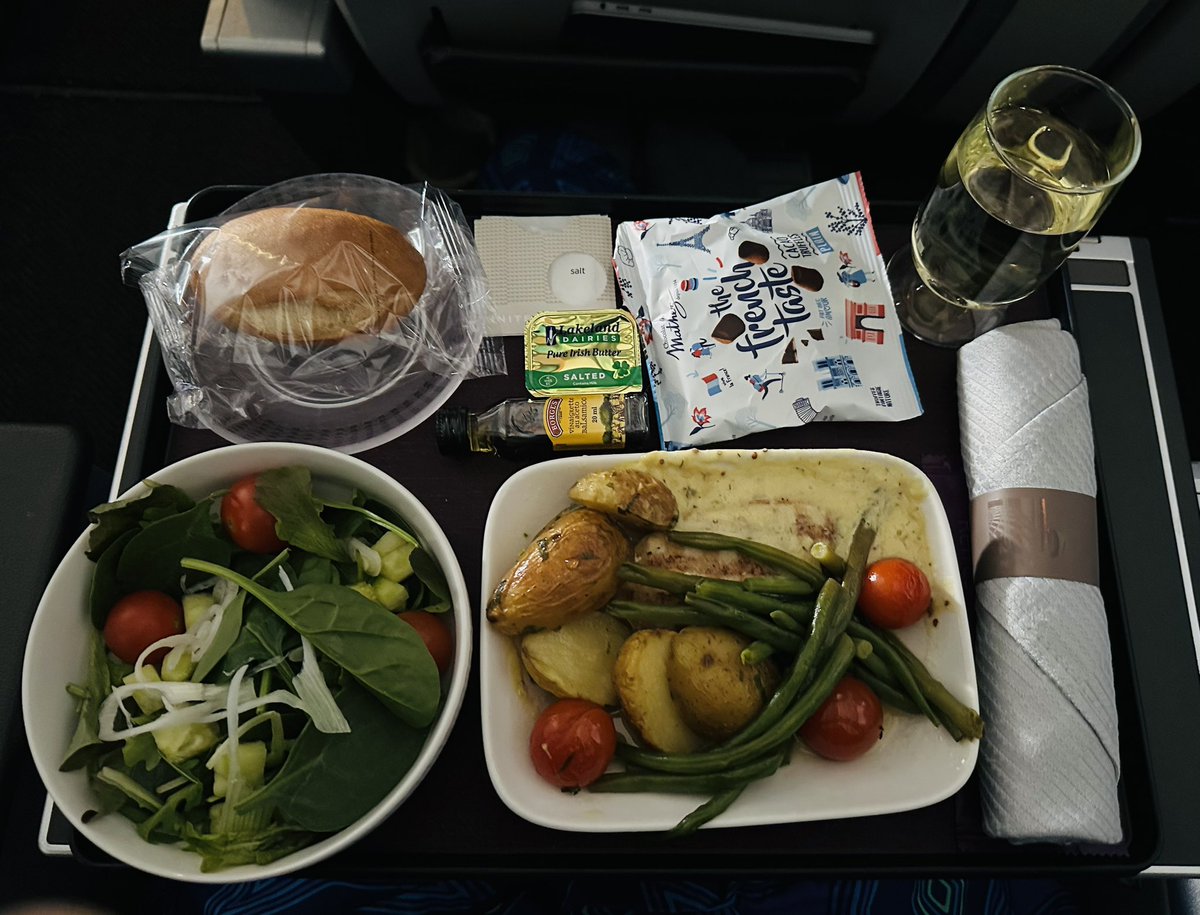 What goes with “Barbie” inflight? How about chicken in white wine &amp; tarragon sauce that tastes like chicken with white wine &amp; tarragon sauce. Used miles to upgrade to international Premium Plus <a href="/united/">United Airlines</a> #worthit
