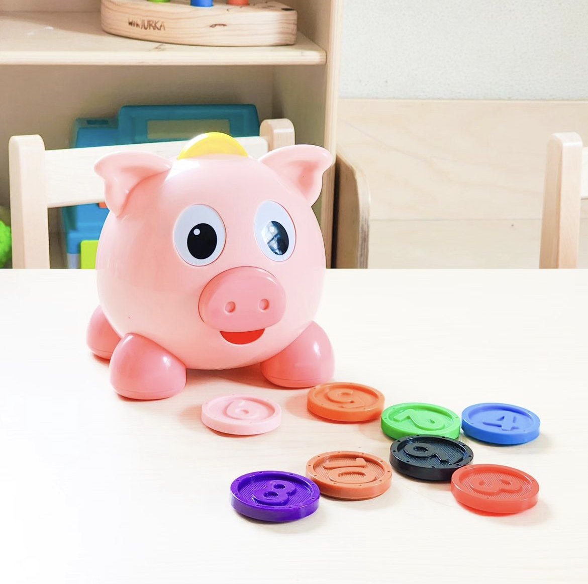 Encourage the development of fine motor skills &amp; hand-eye coordination as your little one learns all about colors &amp; numbers! Learn With Me - Pig E Bank is an adorable interactive learning toy that includes a talking pig-shaped sorter and 10 chunky coins! 🐷✨