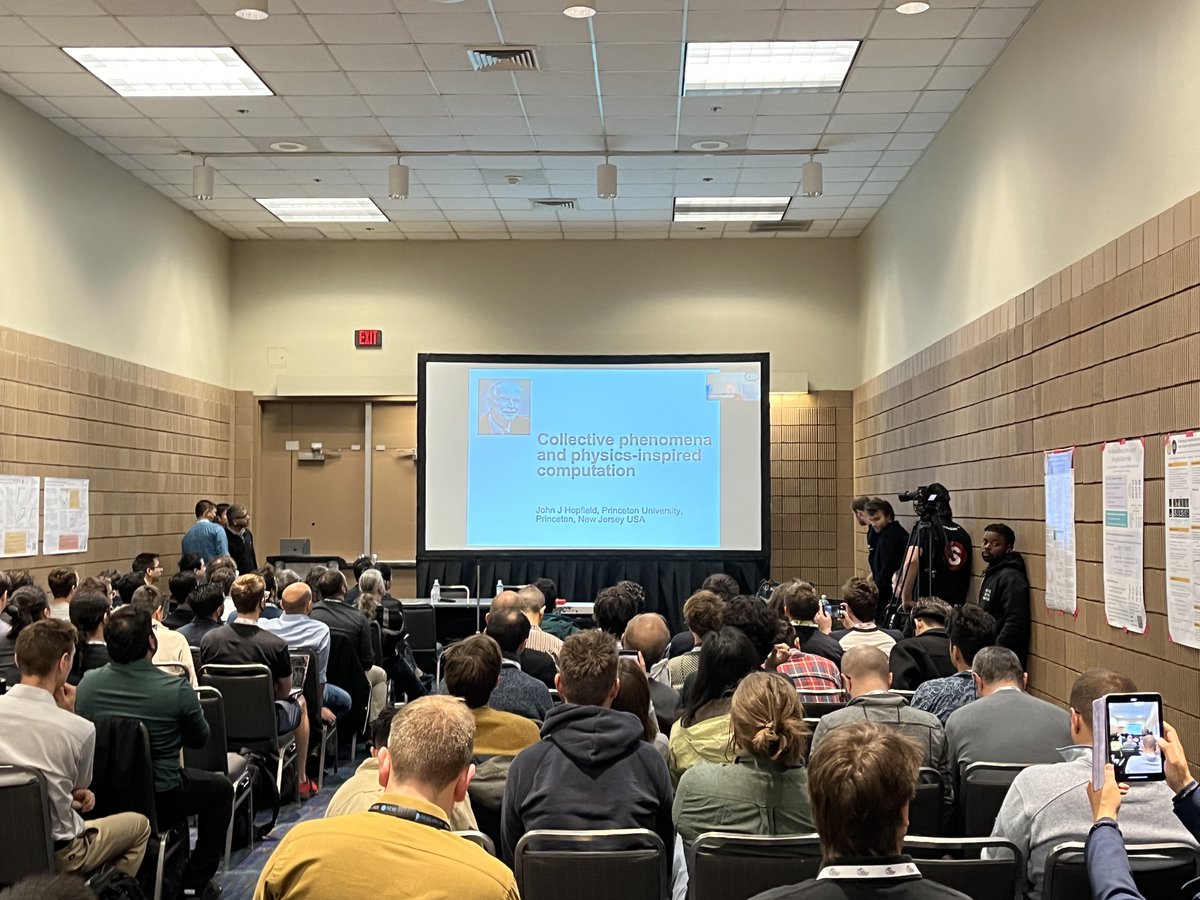 The room is packed for @HopfieldJohn ’s opening talk at the #AMHN2023 workshop at #NeurIPS2023. His presentation covers the fascinating historical evolution of Associative Memory. Beginning with insights into the renowned NRP program at MIT, the origin of the term 'neuroscience”,…
