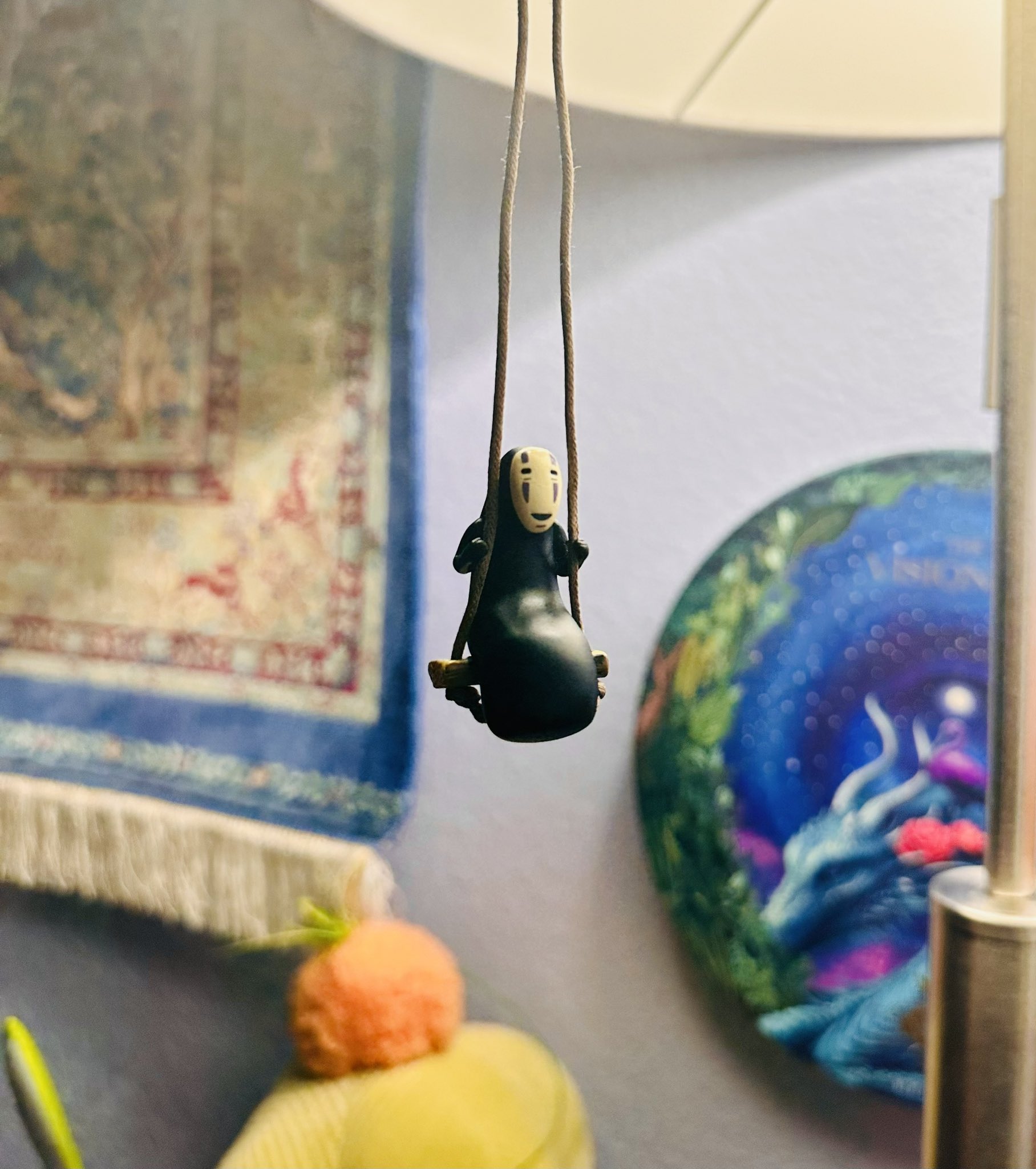 Nnedi Okorafor, PhD🕷️ on X: …And case you were wondering, that is No-Face  on a swing hanging from my lamp, 😁.  / X