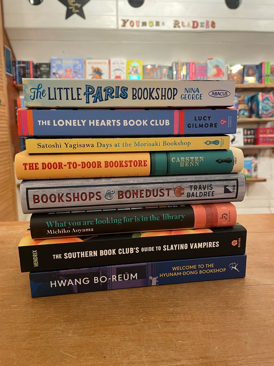 Books about bookshops, libraries and book clubs all stacked up for no reason.