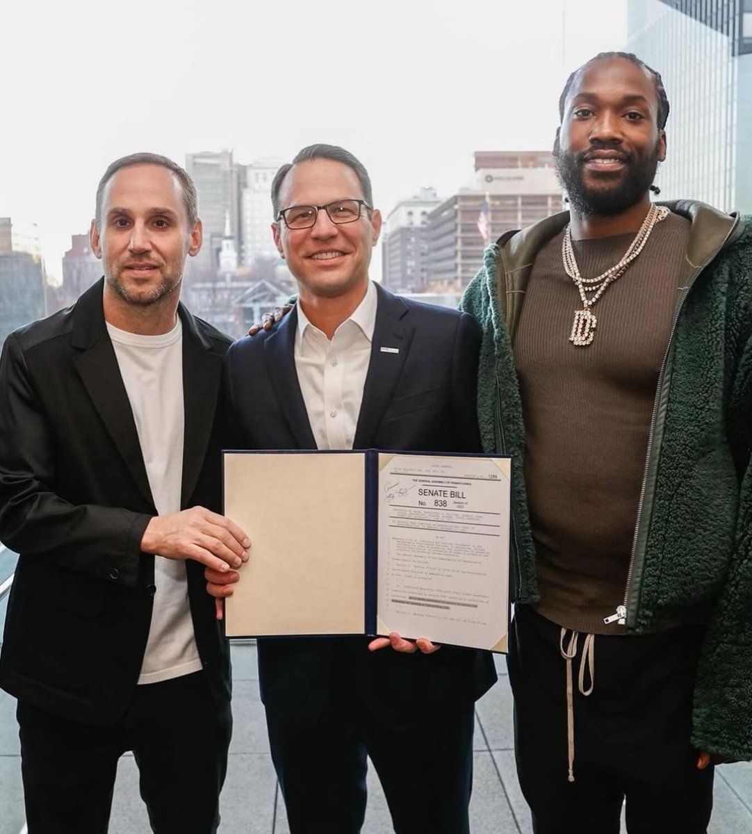 Meek Mill poses with the Govenor of Pennsylvania, Josh Shapiro, and Michael  Rubin at the signing of probation reform bill SB838 📝✍️