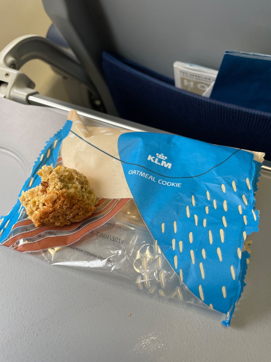 chriswilson789's tweet photo. #1 plane snack discovered. Arguably more of a cake than a cookie, as might be apparent by the thick texture of what’s left - though the cookie classification does come through in the crunchier bite. Thank you @KLM. https://t.co/YRstFEuKKg