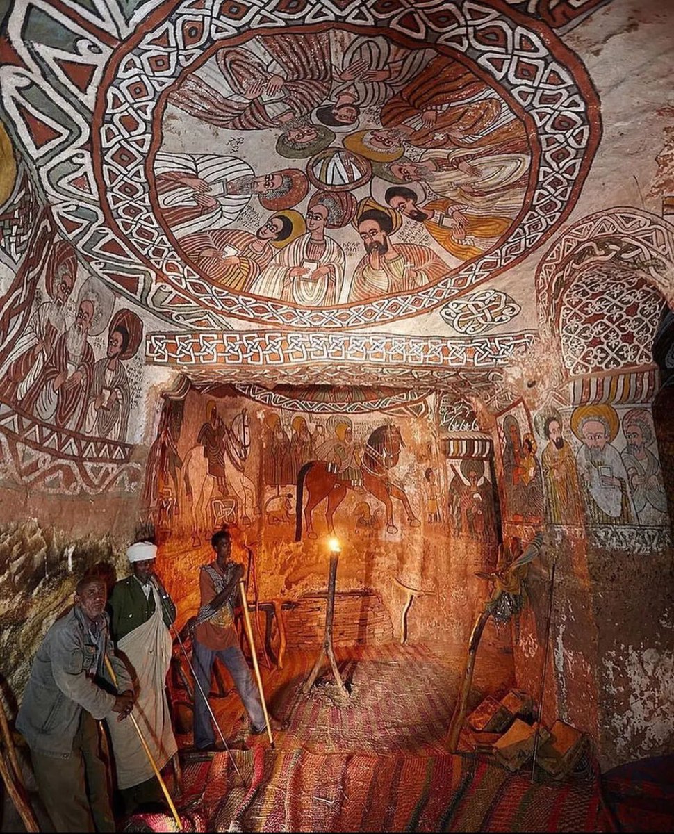 historyinmemes's tweet photo. The incredible site of the mountain church, Abuna Yemata Guh, is a monolithic church located in the Hawzen woreda of the Tigray Region, Ethiopia. It is situated at a height of 2,580 meters (8,460 ft).

According to local tradition, the church was built in the sixth century by one of the Nine Saints, Abuna Yemata. The Nine Saints are said to have come to Ethiopia from various regions, including Rome, Constantinople, and Syria, to spread Christianity and establish a monastic tradition. The paintings in the church are original and have been well-preserved due to the dry air and lack of humidity.

To access the church, one must climb a steep cliff with hand and feet holes carved into it. The ascent is considered hazardous and requires both physical strength and mental fortitude. Abuna Yemata Guh is one of 35 churches in Ethiopia that is built into a high place, making it a unique and awe-inspiring site to visit.