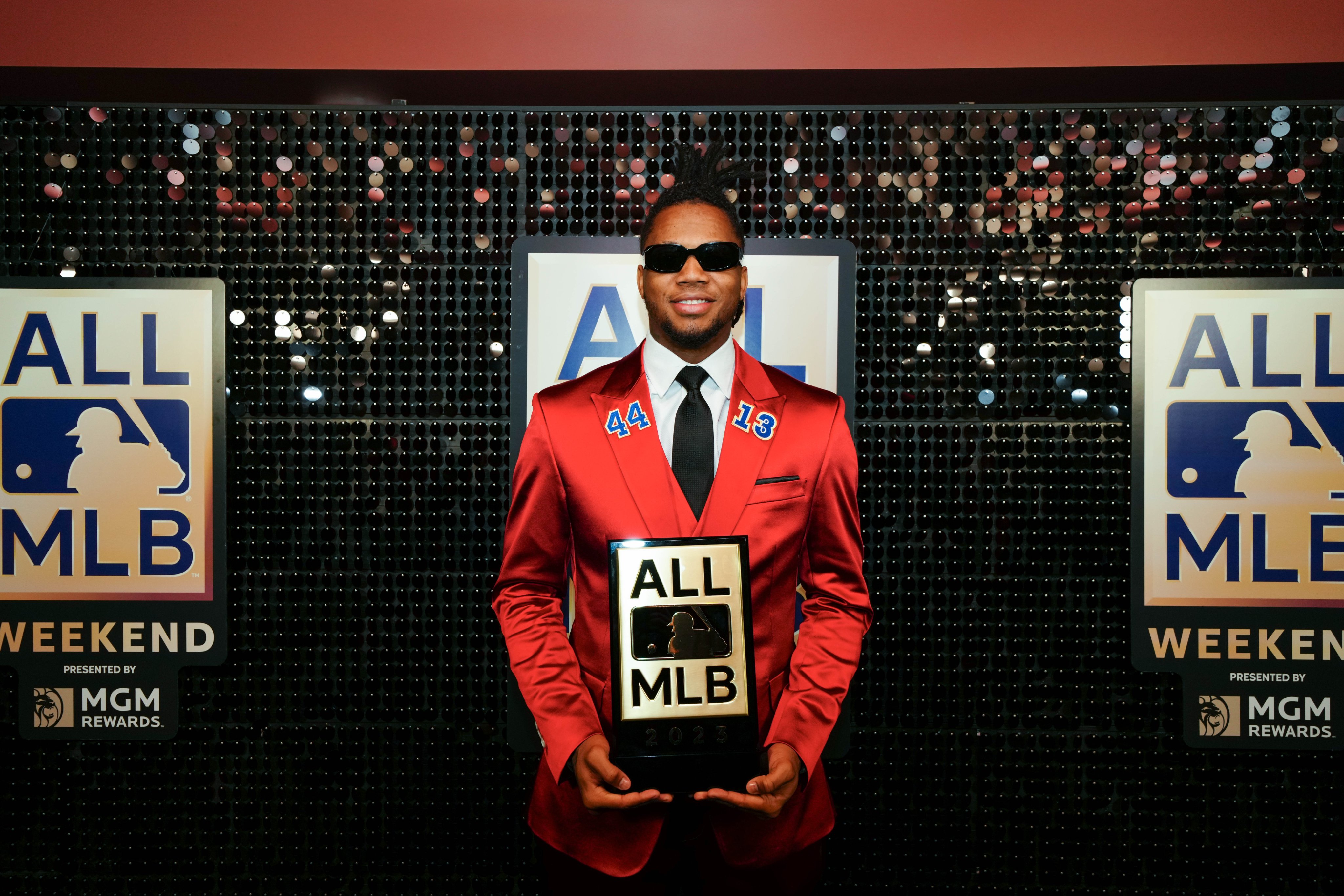 Ronald Acuña Jr. poses with his All-MLB Award plaque. 