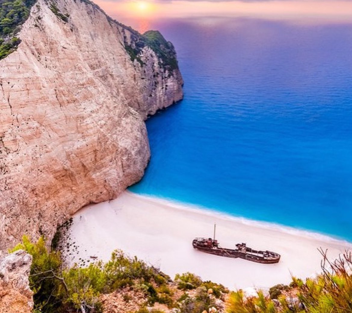 The Panagiotis is a shipwreck lying abandoned on Navagio Beach in Greece. It is a stunning island off the southwest coast of Greece, boasting magnificent beaches, secluded coves, and verdant valleys. While the island is known for its natural beauty, it is perhaps most famous