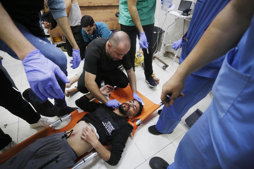 Injured Palestinians, including children, are brought to Nasser Hospital to receive medical treatment following Israeli attacks in Khan Yunis, Gaza on December 17, 2023. Photo by Ashraf Amra