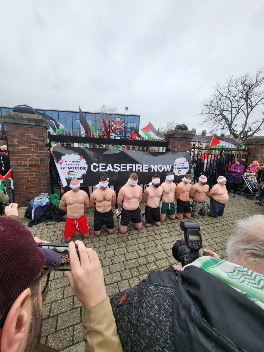 Powerful re-enactment at the March to US Consulate in #Belfast of the despicable degradation of #Palestinian men in #Gaza at the hands of @IDF terrorists .@ipsc48