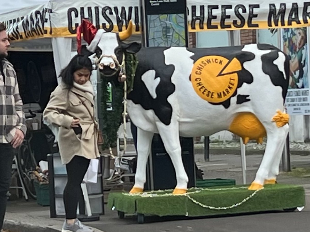 Liberal_Isms's tweet photo. Enjoyed #Cheesewick today. Asked a stall holder what something on her stall was and she replied,
βThatβs Stollenβ
Me: βIβm surprised youβd admit that out loud.β
β¦No one laughed.
On closing the big cow was wheeled away and all the dogs went bonkers. @ChiswickM https://t.co/W6eZRDHxk0