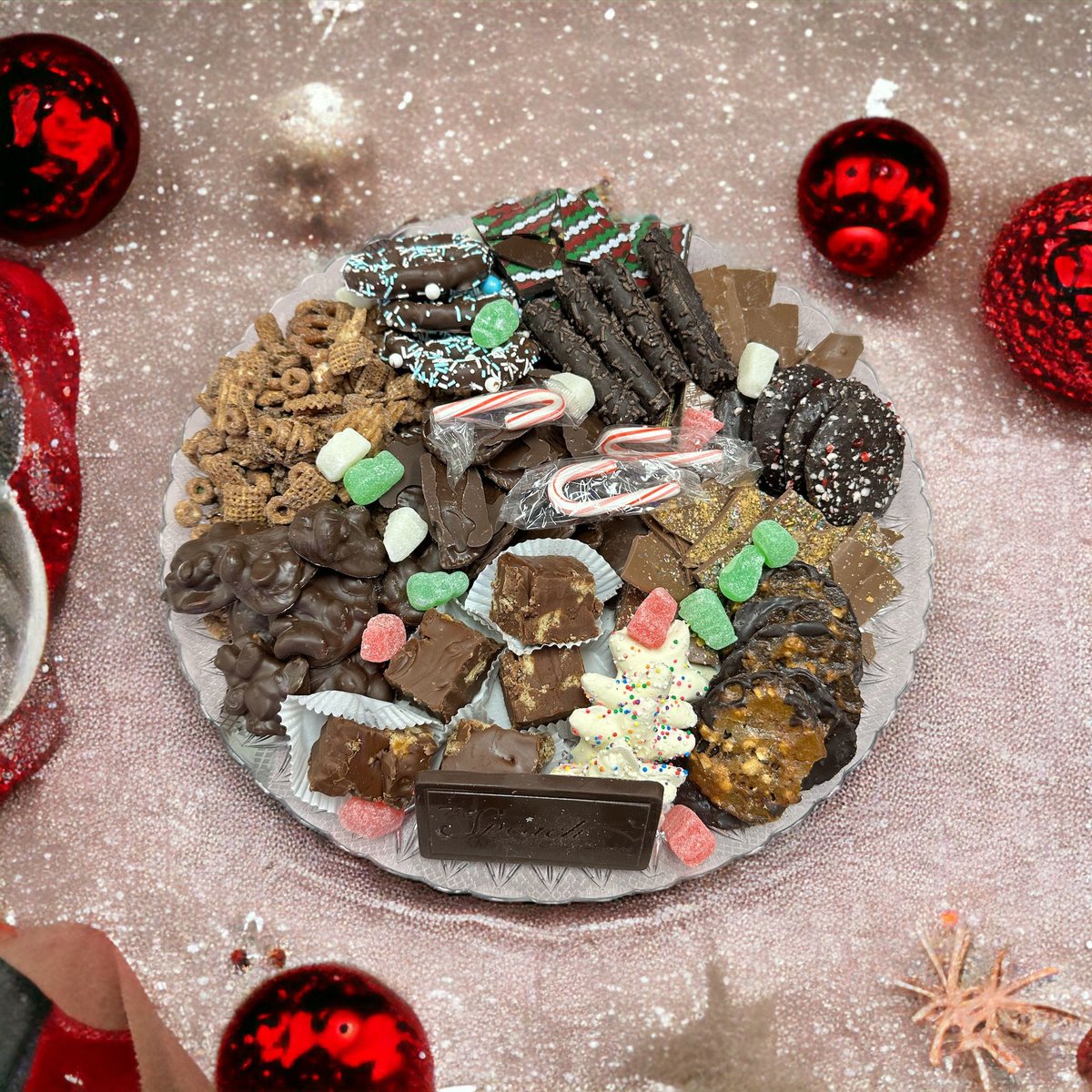 A great option for a group gift or holiday party is our Candy Trays. Packed with a variety of treats, including Chocolate Covered Potato Chips, Pretzels, Party Mixes, Chocolate Brickles, Cookies, and Fudge. Give your friends and loved ones a memorable sweet and savory experience.