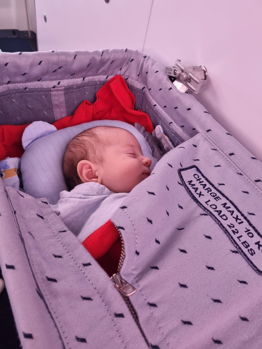 Baby's first flight. On a 14h flight to Gothenburg for Christmas. Bassinet onboard is a saver!