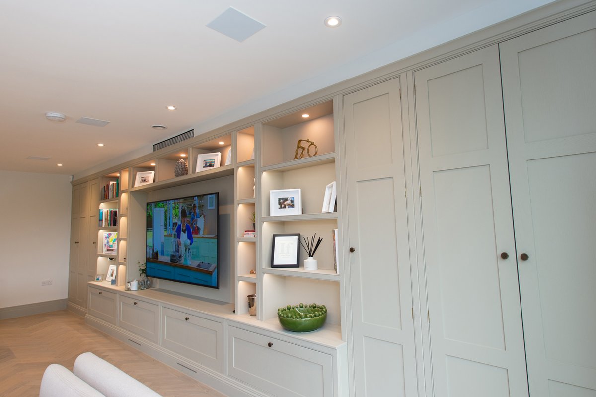 A dedicated storage wall will create plenty of room to display family photos, books and valuable keepsakes with deep drawers and generous cabinets helping to ensuring there's a home for everything! Designed and installed by #Brandt 👉 Brandtdesign.co.uk