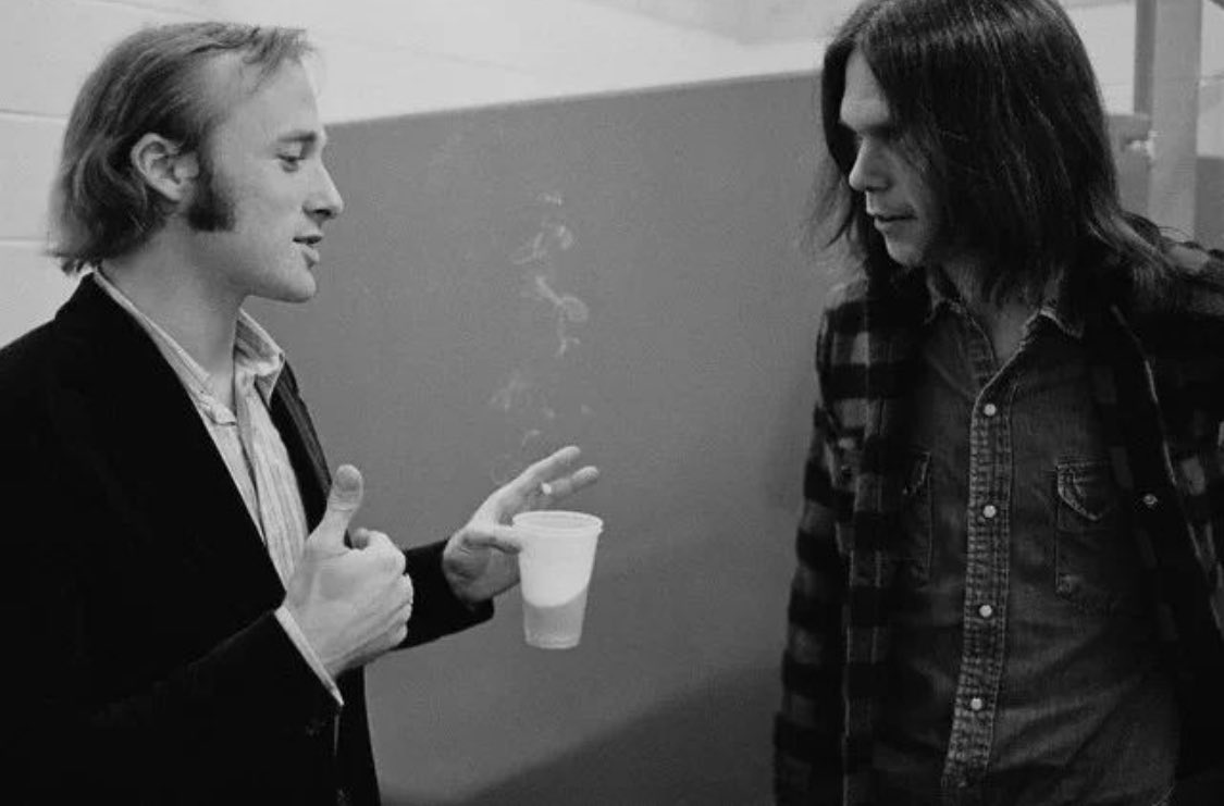 Stephen Stills and Neil Young backstage on July 12, 1970. Photo by Henry Diltz