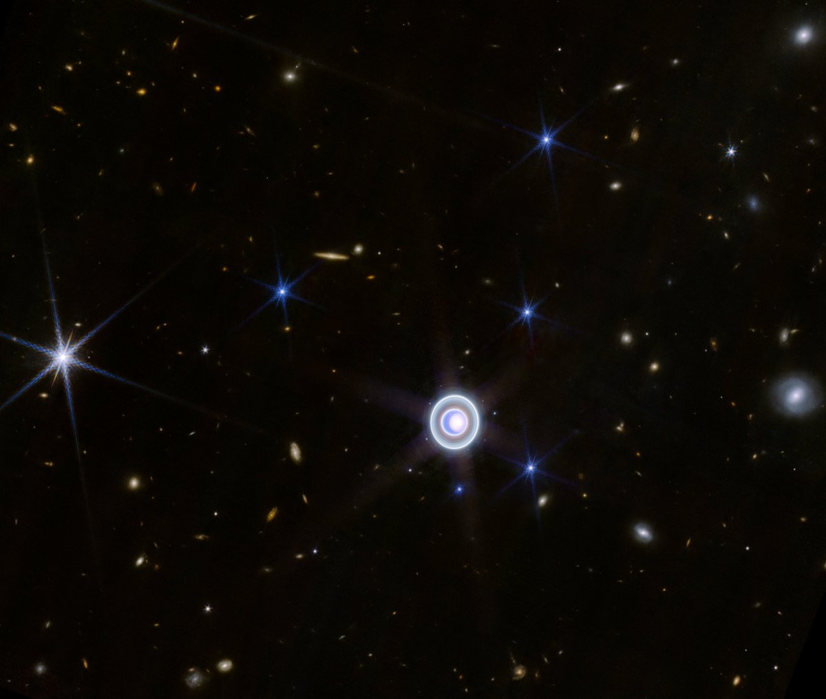 The amazing Uranus WITH GALAXIES! JWST delivers again: an astonishing view of this distant world, chock-filled with rings, over a dozen moons, and  background filled with stars and celestial sights!  Get the full story (plus zoomed &amp; annotated images) at nasa.gov/missions/webb/…