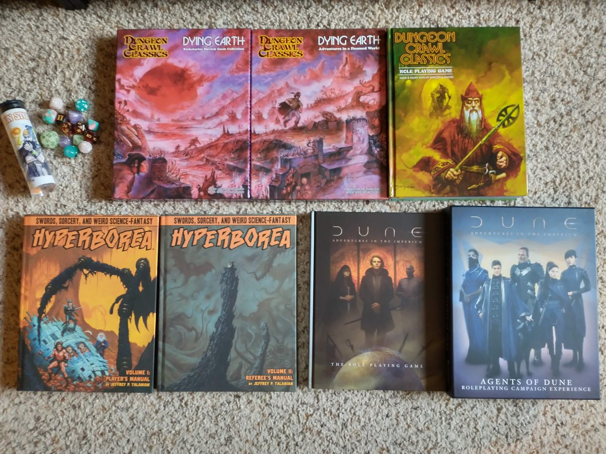 Mail call! A whole set of #DCC #DyingEarth rulebooks + dice. Also #Hyperborea, and #DuneImperium! Excited to read and play all of these in the coming year! #ttrpg #osr #dune #dnd