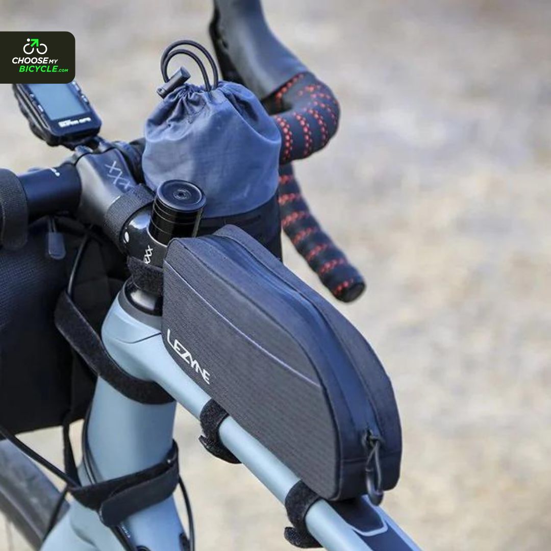 Lezyne Energy Caddy XL Top Tube Bag + A large toptube organizer for quick on-the-bike access ride necessities. + Features a large water-resistant, zippered main compartment with side sleeves. + Reflective features for added safety. buff.ly/41pR8rX #ChooseMyBicycle