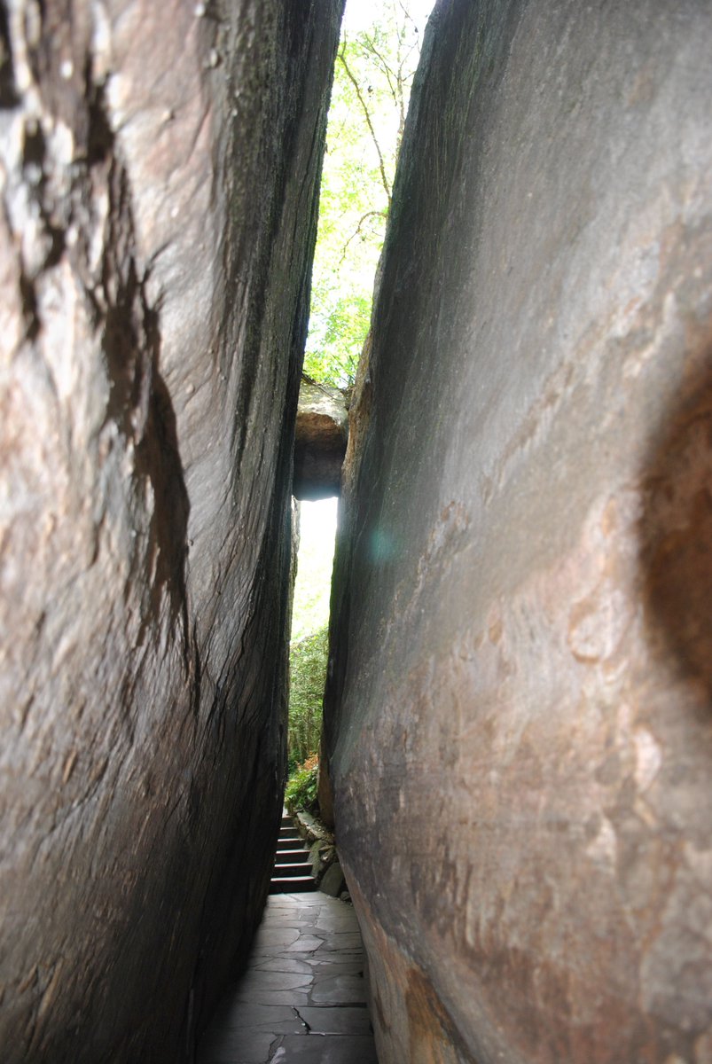 You've heard of Fat Man's Squeeze but there's another narrow stone pathway here known as Needle's Eye. This natural rock formation is one of the first passages guests will walk through during their daytime visit along the Enchanted Trail.