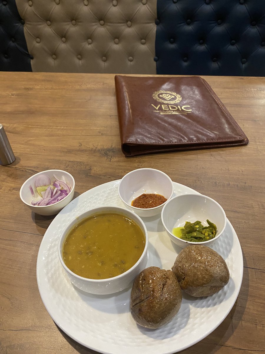 Vedic_restro's tweet photo. Delight in the gastronomic opulence of Dal Bati, a culinary ode where lentil delicacy harmonizes with baked wheat spheres. Each bite, a palatial journey, unfolding the richness of flavors. A rendezvous of tradition and taste, elevating your dining realm. 🌶️🍛 #dalbati https://t.co/a7oShDOfPJ