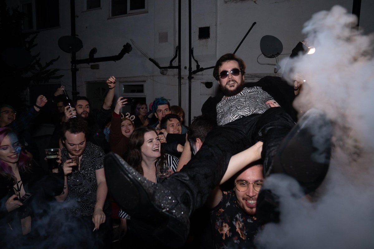 JonDBarker's tweet photo. Lil throwback to one of the most chaotic series of pictures from NYE 2019-20, and @MMikeDeann &amp; @RayRoberts_ leading a crowd surfing moment on the stroke of midnight https://t.co/H43NDP5xbF