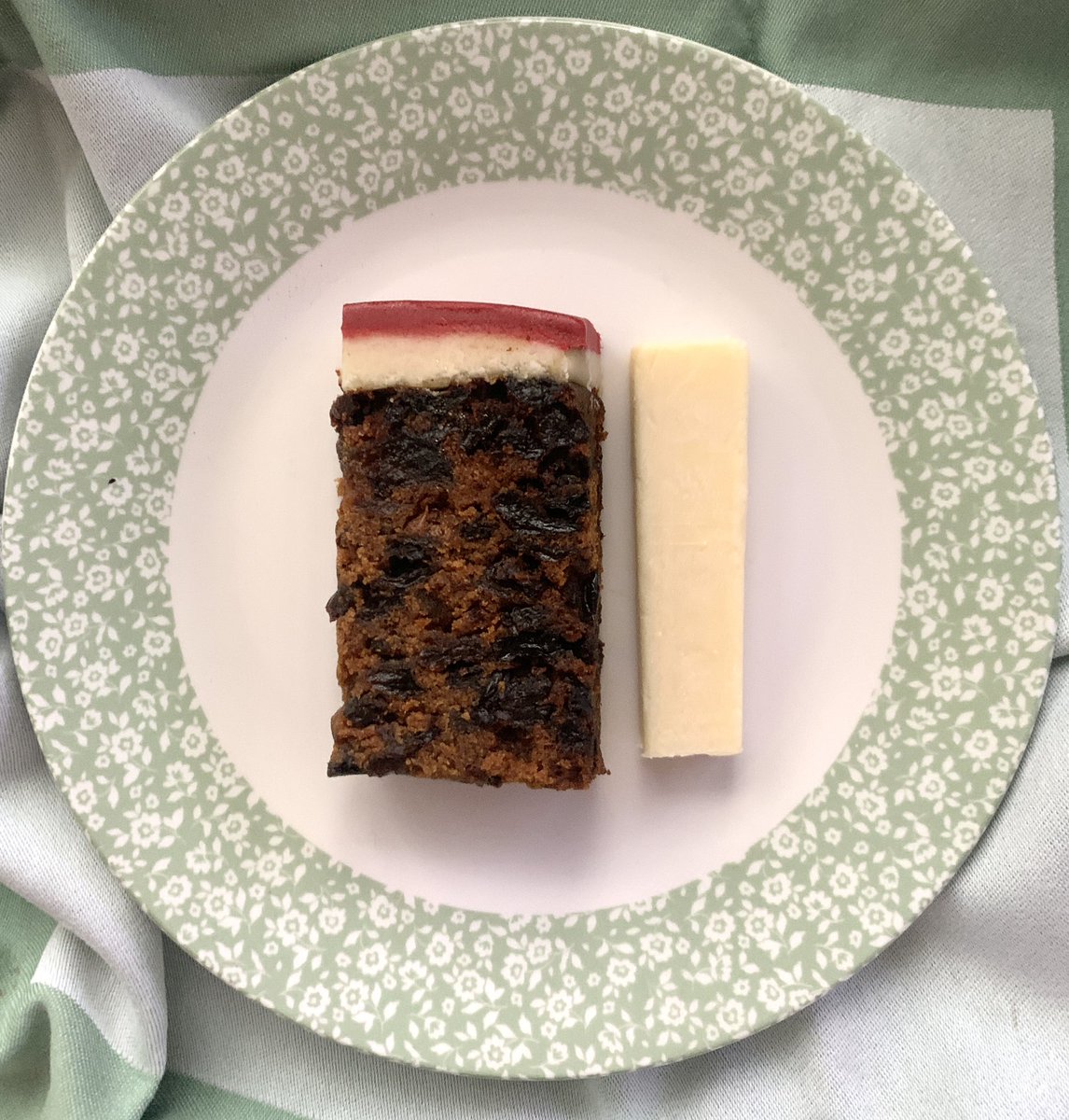 The Christmas cake has finally been cut into … served the northern way with cheese 🎄#fruitcake #christmascake