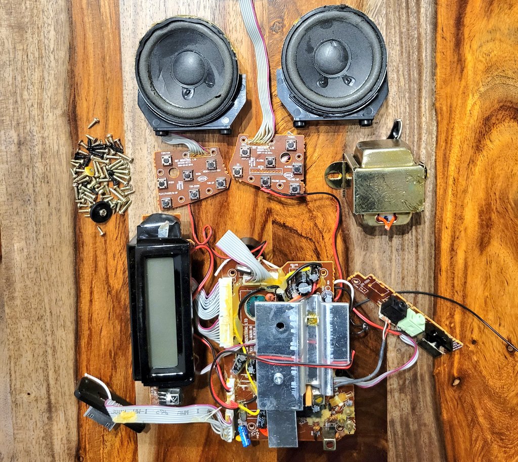 90s-era AM/FM radio! Quite a few boards on this one, 50 million screws, a monster transformer I wasn't expecting (the big brass-looking brick on the right), super neat array of button switches for power, volume, play, pause, tuning, etc. And speakers are still the coolest thing!