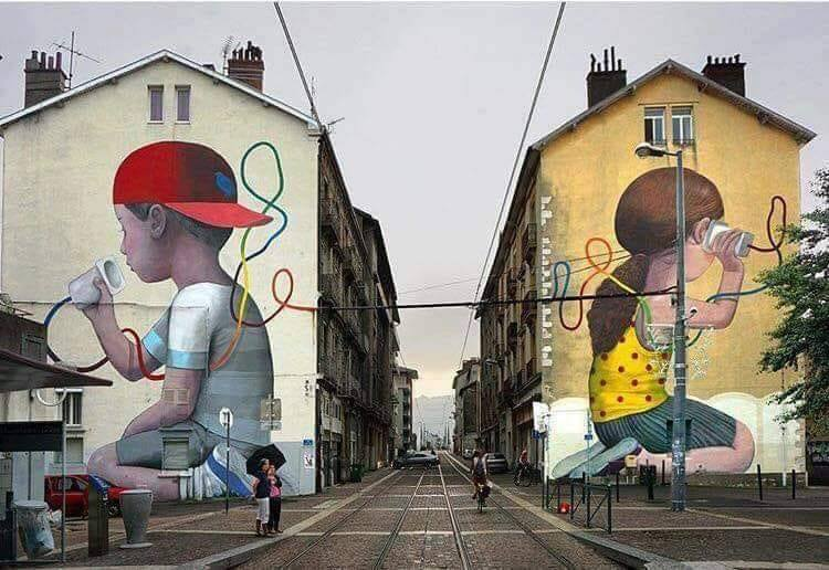 My first walkie-talkie, too… These kids need to get their ham radio license. That way, they know they have to keep the string taut... seriously, this is GREAT street art!