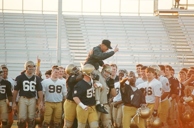 HoltzHeroes's tweet photo. How detail oriented was Coach? At the end of practice on 1/1/89 the team practiced carrying him off the field after winning the National Championship the following day. He didn’t want to be dropped &amp; he wanted the team to envision the moment. ☘️🏈🏆🌳 

📸 Credit: Mike Bennett https://t.co/wkYoQ4rHDb