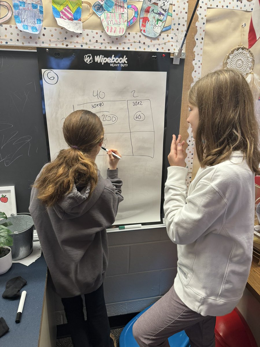 Using what we know about area models to solve 2-digit by 2-digit multiplication!