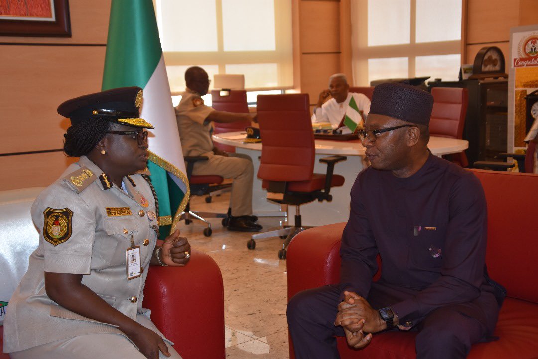 DrJoeAbah's tweet photo. This afternoon, I was around the @nigimmigration headquarters area and decided to go and see the Comptroller General of Immigration Caroline Wura-Ola Adepoju. I just gave my name and she agreed to see me. She said she knows me and is aware of my long campaign to improve passport administration.😊

I commended her efforts so far and gave her my best wishes. She immediately said that she had been getting unparalleled support from the Honourable Minister of Interior @BTOofficial. Well done to him. 

We discussed their plans o minimise human contact in passport processing from next week and a forthcoming innovation to allow virtual capture. I asked how that would work and she said I should look forward to an app that could be used for renewals. 

We discussed corruption in the service and she was very forthright about the need to change the culture and to isolate and punish the offenders. We both recognised that it would not be easy or quick. 

She introduced me to some of her Deputy Comptrollers of Immigration. The gentleman in white is the Director of Finance and Accounts Professor Abah (no relations). He is a professor of finance. The other gentleman is the DCG in charge of foreign missions and the lady is another DCG.  

The Comptroller General said: “You sometimes criticise us but you always proffer solutions. Please don’t relent. It improves us.” I left her office greatly encouraged.