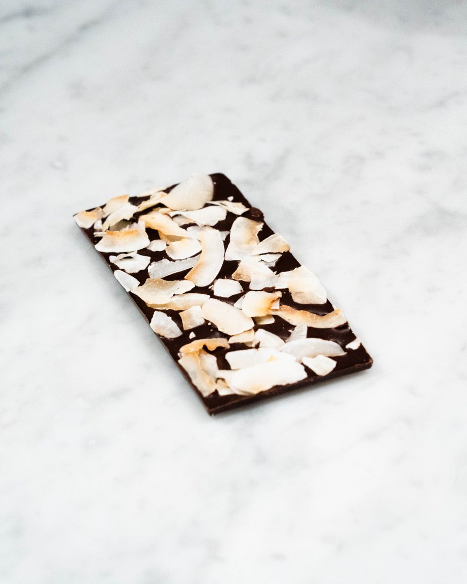 Why did the coconut 🥥🍫 chocolate join the gym? 🏋️‍♂️ 

To get that shredded coconut look! New Year Resolutions are here. Flex 💪on your taste buds 👅 with our Dark Toasted Coconut Bar 🍫 – the only workout your cravings need.  #ChocolateGains #WorkoutCravings  #NewYearsResolutions