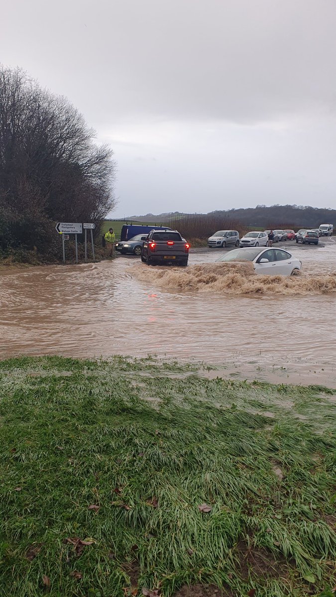 MonkeyManWales's tweet photo. @elonmusk @Tesla I didn't realise you made submarines as well. 😳 Next James bond car maybe? Local flooding in my village in Wales and a driver just sending it. https://t.co/f7qyafnzy1