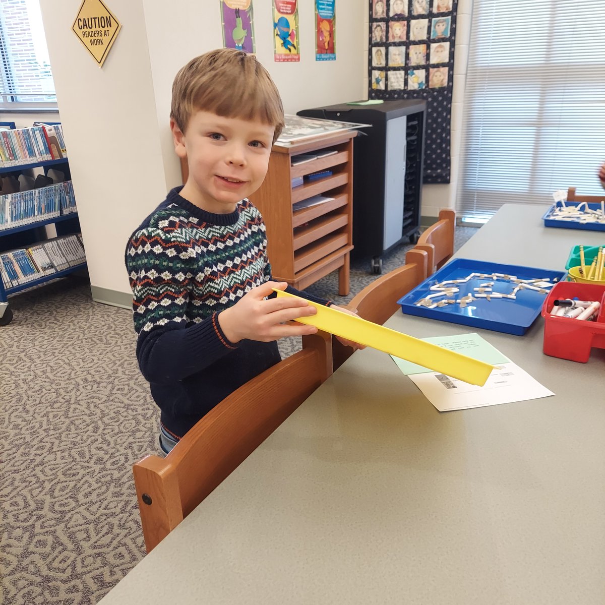 UES_Library's tweet photo. First grade having fun with Jingle Mazes made by 5th Grade friends.  @UEStars #winterfun https://t.co/CWKRqswK6C