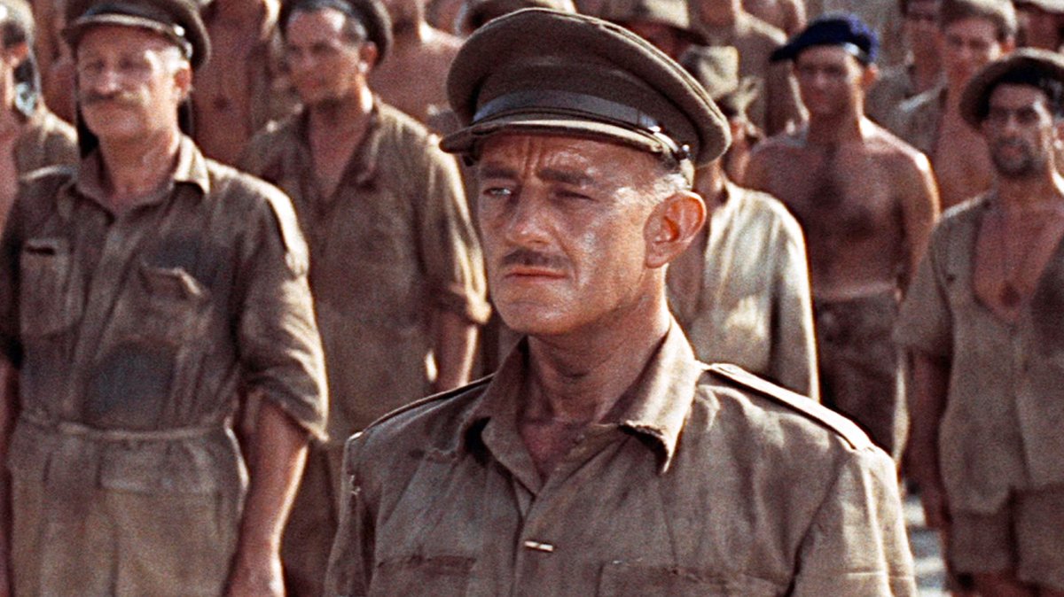 Best line from Bridge Over The River Kwai: 🇯🇵: Do you know what will happen to me if the bridge is not built on time? 🇬🇧: I haven't the foggiest. 🇯🇵: I'll have to kill myself. What would you do if you were me? 🇬🇧: I suppose if I were you... I'd have to kill myself.