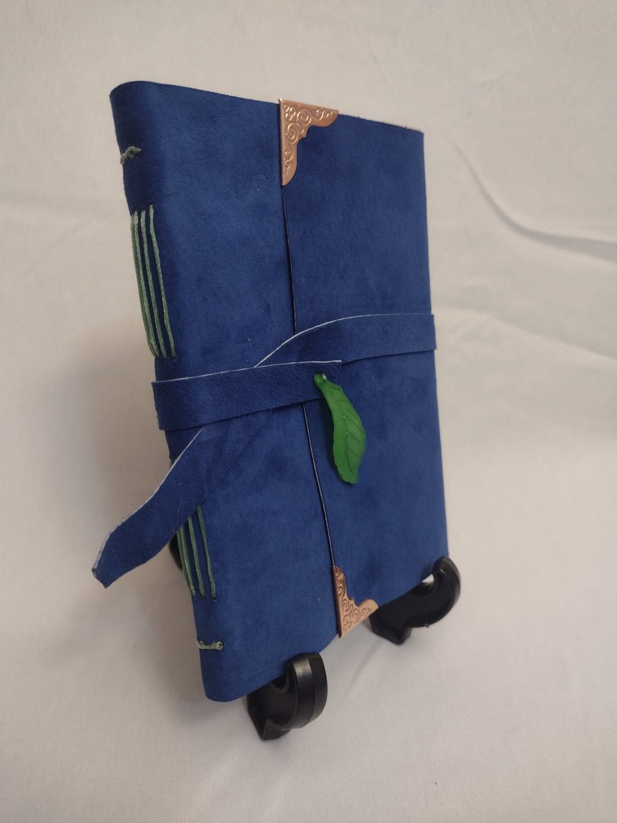 Welcome to Needle &amp; Bone Bindery! I specialize in making custom leather bound journals, and also create hardcover journals and handmade paper.

Here is a journal that is currently available now on my Etsy:
needleandbonebindery.etsy.com