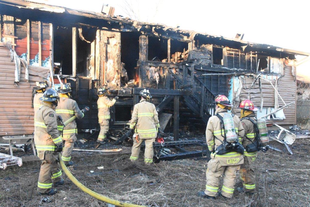 OttFire's tweet photo. Firefighters prevented a house fire from spreading to a close by neighbours home this afternoon. At approx. 14:41, multiple 9-1-1 callers reported a single family home was on fire in the 0-100 block of Parkglen Dr. Heavy black smoke could be seen from a distance by responding crews, so a "working fire" was declared to dispatch additional resources prior to arriving on scene. Firefighters arrived on scene 4min after being dispatched and confirmed the back on the home was on fire and it had spread inside into the kitchen. Firefighters advanced a hose line and began a fast attack while another crew began searching the home for any occupants. The fire had burned off the natural gas line, which was leaking, creating a hazard on scene for Firefighters. The fire had spread into the attic space of the home. Fire crews on the roof removed the roof vents and sprayed water into the attic. The fire was declared under control at 15:05. Fire crews removed parts of the walls and ceilings inside to check for any extensions. Firefighters searched the entire structure and confirmed there were no occupants inside. Three adults, who safely exited the home, will require victim assistance and will be displaced. An @OttFire Investigator was dispatched to the scene. No reported injuries. #OttNews 

📸 OFS Photographer Jean Lalonde