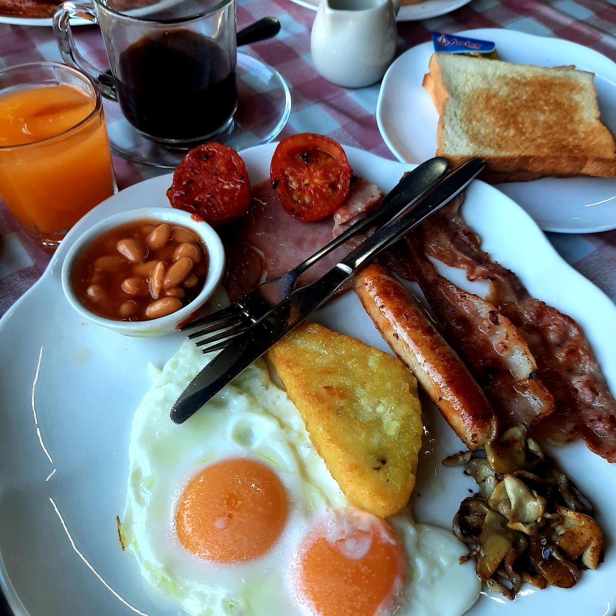 I might have 'The Beardsworth' beat. 
2 eggs, 2 Bacon, Sausage, Hashbrown, Mushrooms, Tomato, Beans, 2 Toast, Coffee and OJ....
199 baht