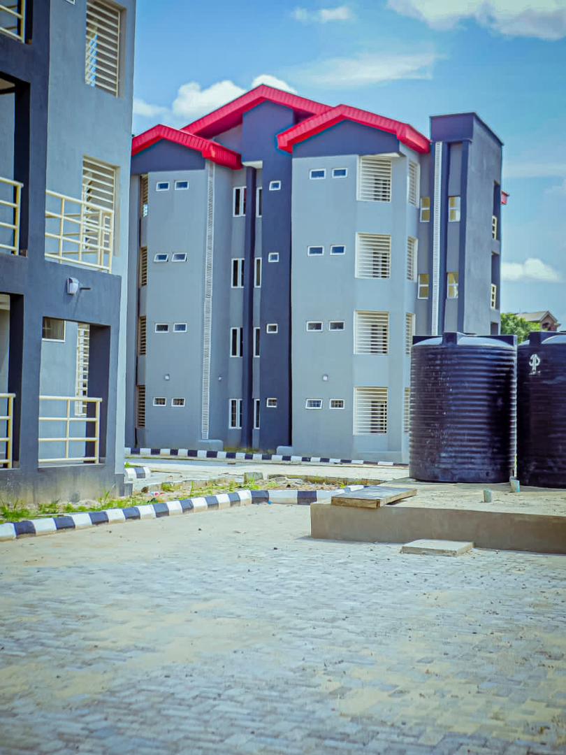 DeeOneAyekooto's tweet photo. FEMI GBAJABIAMILA HALL OF RESIDENCE, UNIVERSITY OF LAGOS

The @femigbaja Hall of Residence is situated on the main campus of University of Lagos, Akoka, Lagos. It is a 484-bed Landmark students hostel facility builts on a total land area of 2924.0 sq.m. 

The facility makes statement and very visible as a landmark structure from both the Bariga and Abule Oja appoaches to the main gate of the University.

The University of Lagos is the first Federal Government-owned university in Nigeria, established on October 22, 1962 by an Act of Parliament. It is a research-oriented university which places premium on innovation and sound scholarship. It parades a wide range of academic programmes at the undergraduate and postgraduate levels, offered on a full-time and part-time basis. It has three campuses which include: the Main Campus at Akoka, College of Medicine, Idi Araba, and the Radiography Campus at Yaba.

With a student population of about sixty (60) thousand, the current hostel bed spaces on the main campus is less than nine (9) thousand. This has resulted in a huge gap in hostel accommodation/bed spaces needs for students on campus. This has also resulted in constraint for the University to take on adequately, considerable number of international students.

The Femi Gbajabiamila International Students Hostel Complex comprises of 4 blocks; A , B, C, D
Each block is built on total land area of approximately 23m x 64m = 1472.0 sq.m. each. The blocks are largely structured as 4-man rooms and also with some single occupancy rooms.
• Number of 4-man rooms per Block = 57
• Number of Beds per Block = 228
• Number of Wardrobes = 114
• Number of 1-man rooms per Block = 12
• Number of Beds (1-man Rm) per Block = 12
• Number of Wardrobes (1-man Rm) = 12
Other facilitities provided for the student- occupiers in each block are, but not limited to the following:
• Furnished Common Room =1. The common room is furnished with 15nos double seater chairs with a fairly big smart TV.
• Furnished Reading Rooms = 4. The reading rooms are furnished with tables and chairs for maximum of 48 users at once.
• Each hostel Block is provided with 1no Buttery to provide for some of the daily needs of residents.
• Each block of Hostel has 13no kitchennettes where the students can also cook for themselves.
• All rooms are provided with ceiling fans for the comfort of residents.
Apart from the above listed, 8no 10,000 litres each, surface water tanks have been provided to boost and guarranttee adequately treated water supply from the University mains. The complex will be connected to the University power grid.

With the completion of this project, international students from different countries and different cultural backgrounds will also find this Hostel to be “HOME AWAY FROM HOME” as the facility is expected to provide affordable housing for students under a harmonised, diversed socio-cultural atmosphere, with students sharing common areas, lounges, kitchennettes and bathrooms.
Hostel life is indeed a great way to make new friends worldwide and to learn about different cultures. We are looking forward to all students who will be previledged to be housed in this magnificient facility to experience this.
The Femi Gbajabiamila Hall of Residence is a support to the University of Lagos by the Chief of Staff to the President, a distinguished alumnus of the university. The project began with a groundbreaking ceremony in January 2021 when he was the Speaker of the House of Representatives..